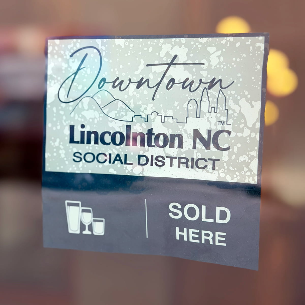 social district blue sign - beverages sold here